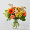 Introducing our Autumn Sunshine Bouquet, a vibrant blend of orange roses, delicate