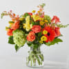 Introducing our Autumn Sunshine Bouquet, a vibrant blend of orange roses, delicate