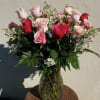 This is a dozen and a half assorted pink roses in a