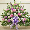 Funeral Basket with seasonal mixed flowers in white &amp; lavender.  Bow