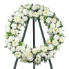 Assorted, seasonal fresh flowers in white send your deepest condolences.