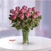 Pink Roses designed with premium accent flowers in classic vase