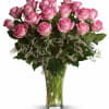 Pink Roses designed with premium accent flowers in classic vase