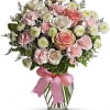 Pretty pink roses, spray roses and miniature carnations, white button spray chrysanthemums