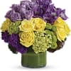 This chic arrangement includes miniature green hydrangea, lavender and yellow roses, purple