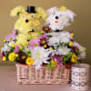 two puddles made with carnations sitting on a basket garden of daisies