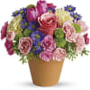 A warm terra-cotta pot and lots of fun colors give this bouquet