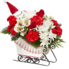 Send holiday cheer in the form of a festive holiday arrangement with