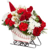 Send holiday cheer in the form of a festive holiday arrangement with