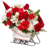 Send holiday cheer in the form of a festive holiday arrangement with