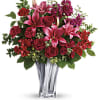 Sleek and chic, this sterling silver mirrored, blown glass vase adds a