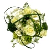 A modern all white and green floral bouquet styled in a clear
