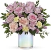 Fresh as a spring breeze, this whimsical, blush-hued bouquet is presented in