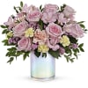 Fresh as a spring breeze, this whimsical, blush-hued bouquet is presented in