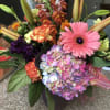Precious garden: in a cube vase with gerbera daisy,  lilies, hydrangea