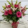 Beautiful mixed arrangement in different shades of pinks with a touch of