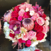 This beautiful design includes White hydrangea, cymbidium orchids and roses, spray roses