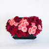 This arrangement of Red roses, peach roses, and red anthurium is perfect