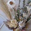 This everlasting dried arrangement includes dried Peonies and pampas and comes in