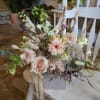 A combination of soft toned fresh flowers and neutral dried flowers that