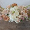 Soft Embrace is a serene and elegant floral arrangement that brings a