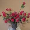 A modern take on traditional red roses. Three dozen red roses asymmetrically