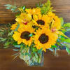 Let this bright and cheery arrangement of sunflowers make someone smile!
Standard arrangement