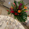 Elevate your event with our stunning floral centerpieces, custom-designed to match your
