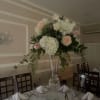 Elevate your event with our stunning floral centerpieces, custom-designed to match your