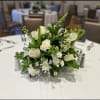 Elevate your event with our stunning floral centerpieces, custom-designed to match your