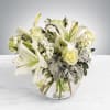 This arrangement includes white roses, white asiatic lilies, white stock, and dusty