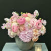 A Beautiful all pink arrangement in a concrete container using Pink Hyacinth