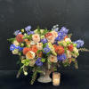 Brighten your space with Sunset Harmony, a vibrant arrangement of peach dahlias