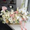 Rectangular vase with blush white and nude color flowers