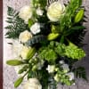 A serene mixed arrangement that showcases a white and green palette, featuring