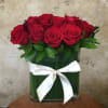 One dozen premium red Rose, and nice greens in glass vase. (available