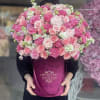 Gorgeous burgundy velvet box arrangement with garden roses, different pink toned roses