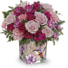 Like a hummingbird flitting around a secret garden, this delightful bouquet of