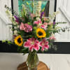 She is beauty, she is grace! This arrangement is handcrafted with luxurious