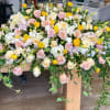 Foliage: Cream Rose, Blush Pink Rose, Hydrangea, Ranunculus, Tulip, Freesia, Dendrobium Orchid