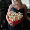 Mix of beautiful flowers in a heart box