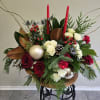Wooden vase with red roses, spray roses, eucalyptus, magnolia leaves, and pine.