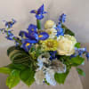 Beautiful and peaceful, this mixture of blue, green and white garden flowers