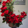 Make a bold, passionate statement with this stunning arrangement of roses arranged