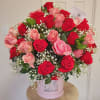 Large hat box arrangement with approximately 75 roses. It is impressive in