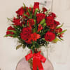 Crystal vase arrangement with 24 red, vivid roses, various stems of red