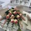 A bouquet of 6 pink roses and mini roses and other seasonal