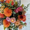 A darling mix of Dahlias and Roses make this a delightful gift!