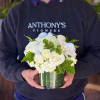 This delicate arrangement uses a lush, compact design to showcase beautiful Playa