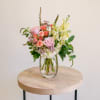 This enchanting arrangement features a soft colorful palette of roses, stock, hydrangeas